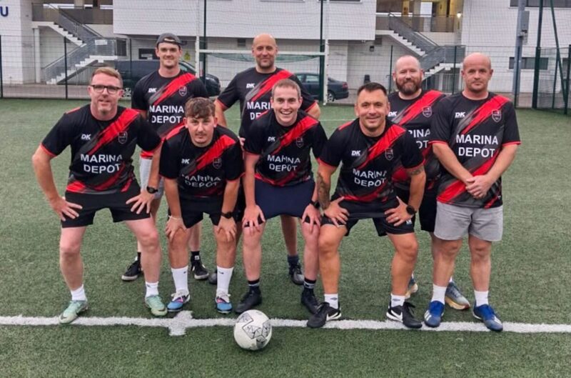 Conack Marina Depot football team wearing their new team jerseys